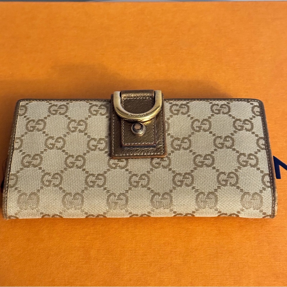 Gold Gucci Bi-Fold Wallet